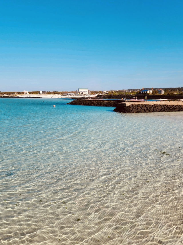 Jeju's Iconic White Sand and Emerald Waters with Island Views