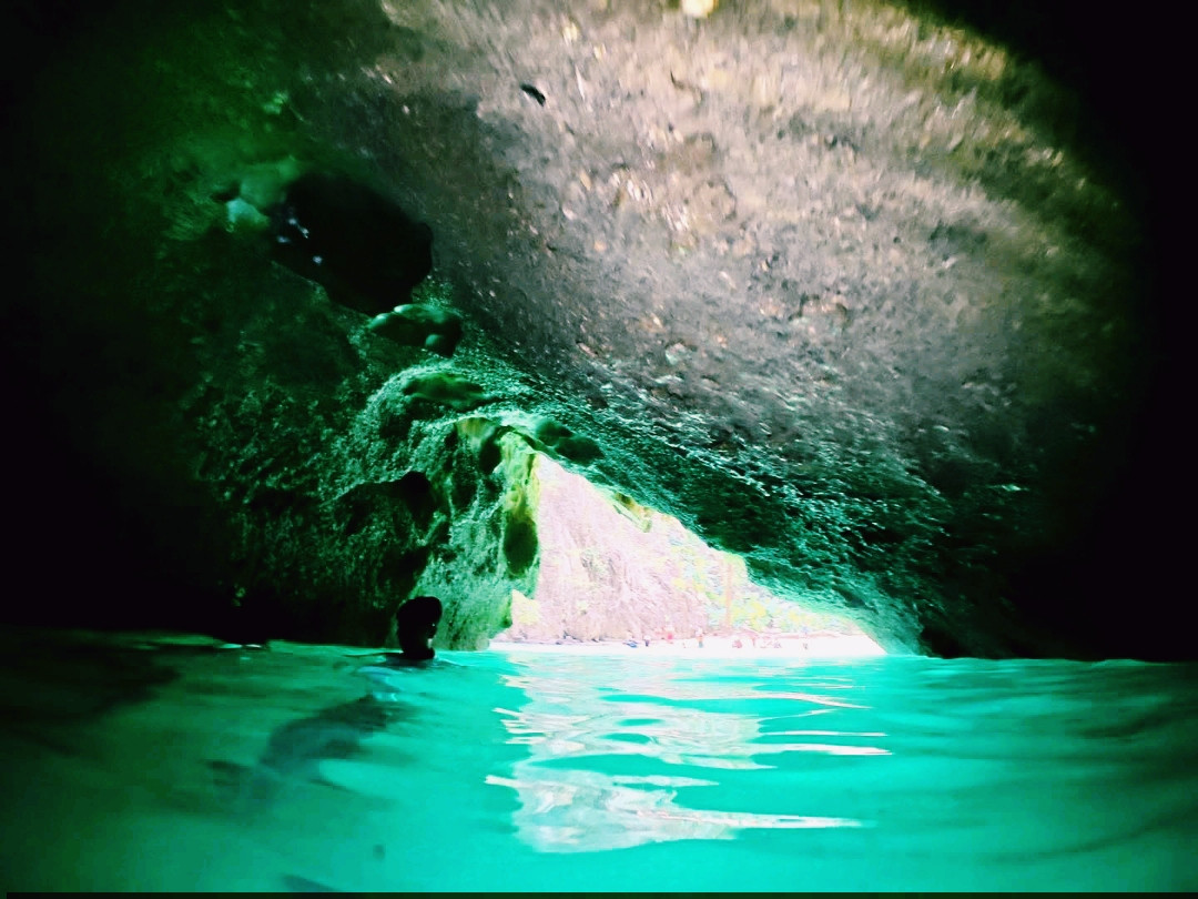 Swim through a cave to discover an emerald sea An 