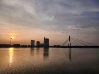 Riga Latvia

🌄 Walking through Riga’s Old Town is like entering a perfect blend of Baltic history and modern vibes — especially around Dome Square. Dome Square (Doma laukums, Centra rajons, Rīga, LV-1050, Latvia) is open all day, so you can explore whenever you want! The buildings here have gray facades that really stand out during sunrise or sunset (pro tip: head over when golden hour hits for dreamy photos). Even if it’s cloudy or rainy, the Western-style architecture and outdoor cultural landscape feel like something out of a European storybook.

If you crave nature alongside city sights, add a stroll by the river or ponds just outside the old city. Riga’s little shoreline is surprisingly peaceful, offering beautiful views when the weather turns sunny — bring a camera for those water reflections!

Here’s my quick tip: don’t rush through Dome Square. While there’s not much daytime buzz, grab a coffee or snack and let the quiet sink in. The mood shifts throughout the day and you’ll catch details in the modern and classic architecture you’d otherwise miss.

Getting around is super easy — Riga’s old town is walkable. No need for taxis or buses, just lace up comfy shoes and start exploring. For food, check out any local café near the square: try Latvian rye bread and local pastries for the true flavor.

Weather-wise: it can flip from sunny to rainy fast, so pack a light jacket!  
#RigaWalks #LatviaTravel #DomeSquare #EuropeanCities #NatureVision