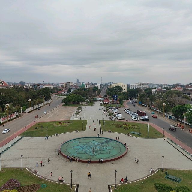 Ascending to Elegance: Patuxay's Embrace Above Vientiane