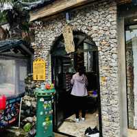 Quaint stone village under Yulong Mountains