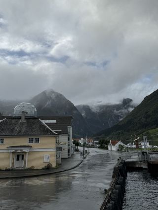 A small town nestled in the embrace of a peaceful fjord