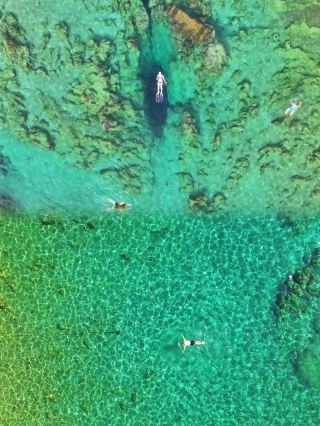 Swim in the Devil's Eye and explore the Blue Hole, a 2-hour drive from Nanning.