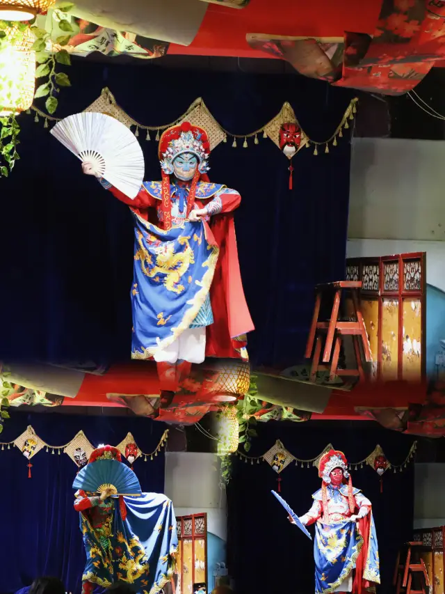 Watch Sichuan opera at Jinli Ancient Street in Chengdu.