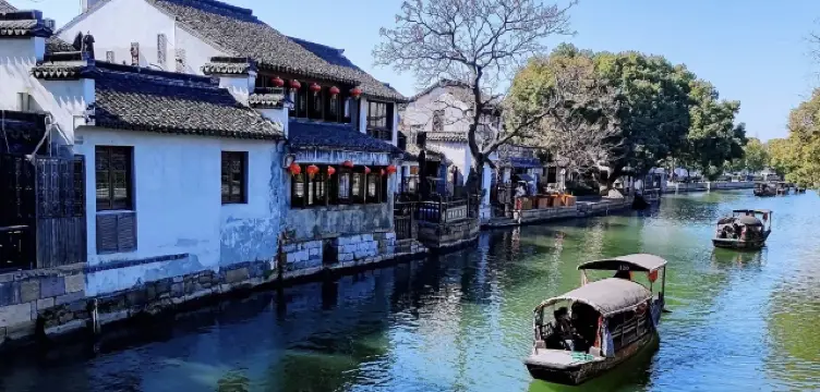 You have to visit Xitang at night at least once, after dark, when the lights come on. 