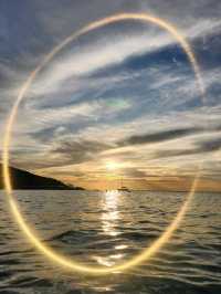 "A white sandy beach with clear water, perfect for swimming and spending the whole day in the water.