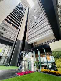 “Elegance in Motion: The Grand Lobby and Iconic Spiral Staircase of Hotel Maya KL”