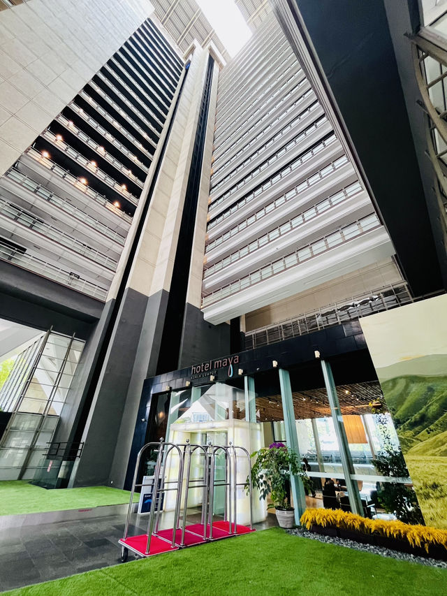 “Elegance in Motion: The Grand Lobby and Iconic Spiral Staircase of Hotel Maya KL”
