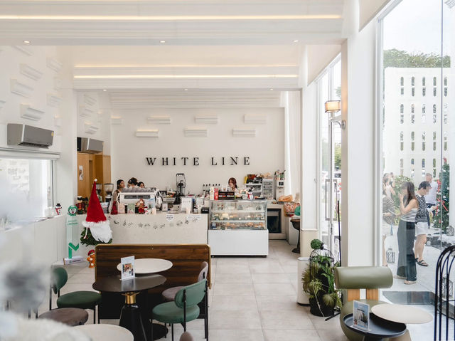 The café's minimalist white interior