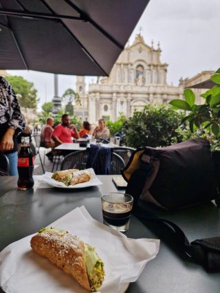 Sicilian Charm in Catania 🏖️⛲️🌋

Catania is the vibrant gateway to eastern Sicily, where history, culinary adventures, and volcanic majesty intertwine. Start your journey at Piazza Duomo—snap the iconic elephant statue and Baroque Cathedral for the ultimate “I’m in Sicily!” shot. Wander along Via Etnea, lined with shops, cafés, and pastel facades; grab a quick arancino for a classic street snack. Head to the lively Pescheria market, where locals barter for fresh seafood (morning is best for atmosphere and photos!). Next, explore the ancient Teatro Romano—its weathered stones and underground tunnels offer dramatic photo ops and a cool respite from midday heat.

Don’t miss Villa Bellini Park, a green oasis, perfect for people-watching and panoramas of Mount Etna in the distance. For an evening stroll, loop back through Piazza Stesicoro, where ruins of Roman Amphitheatre glow at golden hour—another must for your camera roll. If visiting between May and September, expect warm temps up to 30°C; lightweight clothing and a refillable water bottle are essential. Note: Some attractions close midday for siesta; plan visits before 1 PM or after 4 PM.

For a real treat, hop on a regional train or bus to the foothills of Mount Etna (best guided early morning)—the lava landscapes are surreal, but bring sturdy shoes and sunscreen. My tip: If you’re here on Sunday, markets and shops may close early, so plan lunch and souvenir hunts for Saturday. 

#Catania  #Sicily  #ItalianCities  #TravelGuide  #FoodieTrail 