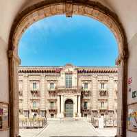 A Solo Traveller’s Retreat: Benedictine Monastery of San Nicolò l’Arena** 🏰