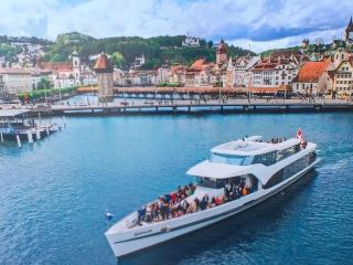 Switzerland - Lake Lucerne: Enjoy a scenic boat ride surrounded by nature's beauty.
