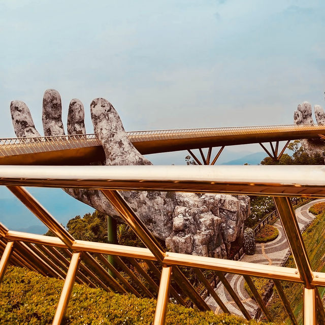 🌉✨ *Golden Bridge (Cầu Vàng): Vietnam’s Giant Hands Holding a Gilded Pathway* 🏞️🌿