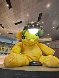 Between Benz and Bear: A Surreal Stroll Through Hamad Airport