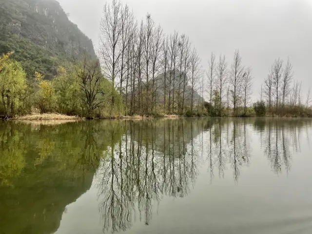 Boating through the mist in Puzhehei scenic area