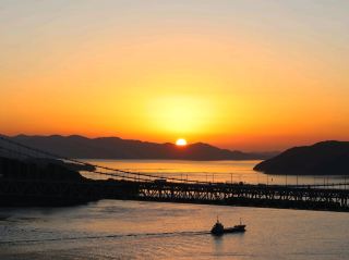 Okayama, Japan - The stunning sunset over the Seto Bridge and the Seto Inland Sea