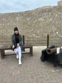 “Whispers of the Past: The Timeless Walls of Bahrain Fort”