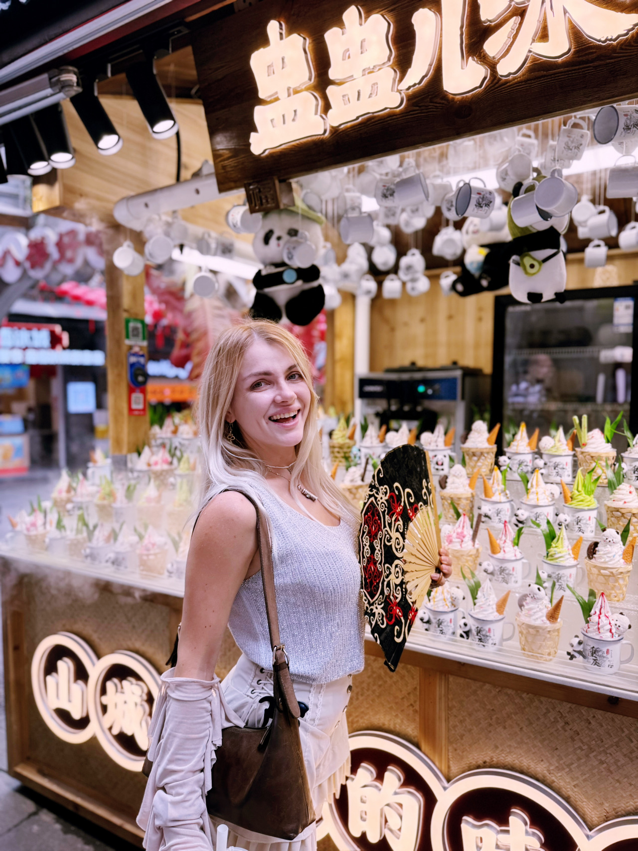 #souvenirguide 
🐼🍦
🐼🍦
When you think China can’t surprise you anymore with its retail creativity, Chengdu (成都) drops the ultimate budget souvenir hack. I just found the most brilliant, adorable, and practical travel find that costs only 25 RMB (approx. $3.50 USD), giving you a double hit of dopamine and pure utility!
While wandering through the historic streets of Chengdu, it is physically impossible to skip the local craft dessert stalls. But instead of serving your ice cream in a boring paper cup or a regular waffle cone, they hand you... a real, miniature metal tin mug designed in a beautiful vintage style!
Inside, you get rich, creamy artisanal ice cream topped with a tiny chocolate miniature panda (Chengdu's ultimate mascot) and other authentic sweets. It is delicious, cools you down instantly in the humid weather, and looks like a million bucks on your social media feed.
But the real magic happens once the ice cream is completely finished:

· The Lifetime Souvenir: You simply rinse the tin mug with water—and boom! You are holding a durable, high-quality souvenir. No useless single-use plastic that you end up throwing in the trash five minutes later.
· The Home Aesthetic: This mini panda mug fits perfectly into a modern, minimalist home design. It is incredibly cute for drinking your morning espresso, using it as a unique sauce dish on dinner nights, or storing rings and small jewelry on your nightstand.
· The Ultimate Price Flex: For 25 RMB in a heavy tourist zone, you can usually only buy a cheap, generic magnet. Here, for the exact same pocket change, you get a premium local dessert AND a lasting keepsake.

This is hands down the smartest and most heartwarming way to spend 25 RMB in Sichuan. I couldn't stop myself and bought several variants to give to my friends back home! It is completely 
Would you buy this sweet combo just to keep the vintage tin mug, or do you prefer traditional souvenirs? Let's talk in the comments! 👇

📍 How to find it:

· Location: Kuanzhai Alley / Kuan and Zhai Alleys (宽窄巷子) or Jinli Ancient Street (锦里古街) in Chengdu.
· How to get there: Take Metro Line 4 to Kuanzhai Alley Station (宽窄巷子站), Exit B. Walk straight into the traditional courtyard lanes and look for the boutique artisanal ice cream and dessert counters.

