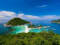 stunning beaches, crystal-clear waters, and lush palm-covered hills