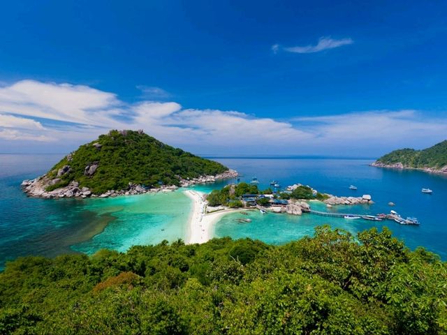 stunning beaches, crystal-clear waters, and lush palm-covered hills