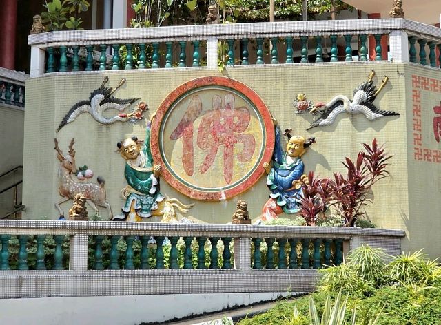Vibrant stories on the Walls in Hall of Universal Brightness car park at Kong Meng San Temple