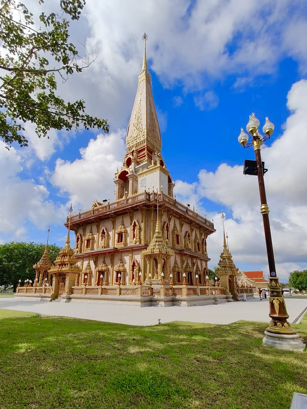 If you're looking to explore beyond the beaches and viewpoints during your trip to Phuket, you definitely need to visit Wat Chalong.

It's the most famous and highly visited temple on the island, having been considered Phuket's spiritual center for many years. Both tourists and locals flock here to pray, leave offerings, and connect with Thailand's rich history.

The complex grounds will impress you with their beautifully manicured gardens, vibrant temple structures, and stunning architecture filled with intricate decorative details.

📍 Location

The temple is located in the Chalong area in the southern part of Phuket.

You can get there:

· by scooter;

· by car;

· by taxi;

· as part of a guided island sightseeing tour.

From the Patong, Karon, and Kata areas, the drive usually takes about 20 to 40 minutes.

🎫 Admission Fee

Entrance to the complex is free.

Donations are voluntary.

⏰ Hours of Operation

The temple is typically open daily from 7:00 AM to 5:00 PM.

It's best to visit in the morning when it's not too hot and there are fewer crowds.

✨ What to See

🛕 The Grand Pagoda

The centerpiece of the complex.

Its multiple floors are adorned with paintings depicting the life of Buddha, and the top deck offers a beautiful panoramic view of the surrounding area.

🙏 Buddha Statues

The grounds feature numerous golden statues and sacred spaces for prayer.

Here, you can respectfully observe locals performing their religious rituals.

🎨 Temple Halls

Inside, you'll find colorful murals, decorative elements, and traditional Thai ornaments.

Every detail is crafted with a deep focus on symbolism and history.

🌴 The Temple Grounds

The temples are surrounded by lush gardens, complete with pavilions and relaxing rest areas.

The vibe here is incredibly peaceful, making it perfect for a leisurely stroll.

🔔 Traditional Rituals

Visitors are welcome to light incense, make offerings, or receive a blessing from the monks.

📸 Best Photo Spots

📍 The Central Pagoda

📍 The staircases and balconies on the upper floors

📍 The golden Buddha statues

📍 The inner courtyards of the complex

📍 The gardens surrounding the temple buildings

🌅 Best Time to Visit

The ideal time to go is in the morning before 10:00 AM.

During this time, you'll enjoy:

✔️ fewer tourists;

✔️ comfortable temperatures;

✔️ beautiful soft lighting for photos;

✔️ a serene atmosphere throughout the grounds.

⌛ How Much Time You Need

Around 1 to 1.5 hours is usually enough to explore the temple.

However, if you want to take your time admiring the architecture and wandering the grounds, you can easily spend much more time here.

❤️ Is It Worth It?

Wat Chalong is considered one of Phuket's top attractions and the absolute best place to dive into the island's culture.

Even if temple-hopping isn't usually your thing, it's worth stopping by for the stunning architecture, the peaceful vibe, and the chance to experience a different side of Thailand beyond the beach resorts.

📍 What to See Nearby in One Day

· Big Buddha Phuket

· Khao Rang Viewpoint

· Phuket Old Town

· Naka Weekend Market

· Chaithararam Road

All of these spots are relatively close to each other and can easily be combined into an action-packed, single-day itinerary in Phuket.