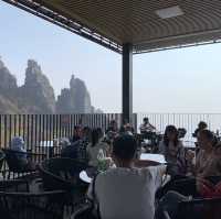 Drinking iced latte on top of Baishi Mountain