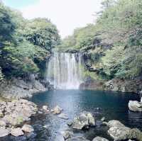 "Cheonjiyeon Waterfall: A Stunning View with a Rainbow on Jeju Island"