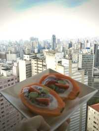 Try home made breakfast on top floor of iconic vintage building of copan with Sao Paulo skyline view