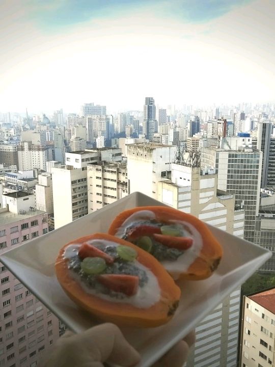 Try home made breakfast on top floor of iconic vintage building of copan with Sao Paulo skyline view