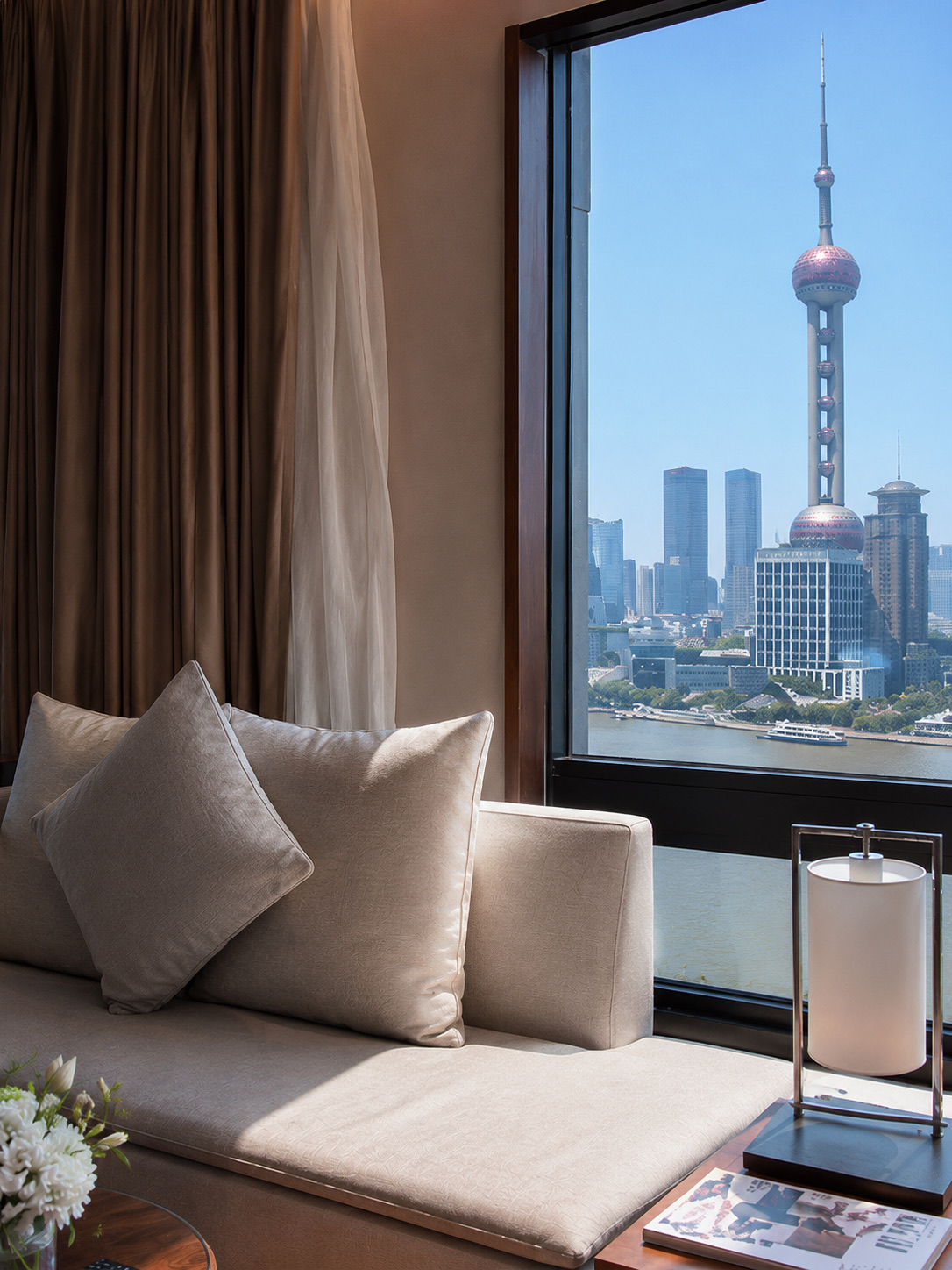 Enjoy the Huangpu River view right from your bed 🌃✨

📍 MaxX By Steigenberger on the Bund Shanghai

This perfectly located 5-star hotel is right next to The Bund on the Puxi side. Just a few minutes' walk from the hotel takes you to the Huangpu riverfront, Shanghai's most popular viewpoint. You can take in the entire Pudong skyline and iconic landmarks like the Oriental Pearl Tower. It's ideal for travelers, photography enthusiasts, and anyone looking for a conveniently located stay in the city center.

🏨 Rooms
The rooms feature a modern design blended with European luxury. Wood and marble accents create a warm, inviting vibe. The rooms are quite spacious compared to typical hotels in downtown Shanghai. The beds are plush and comfortable. Bathrooms have separate wet and dry areas, and select room types include a bathtub.

🌆 Favorite Highlights
· Prime location right by The Bund, making it super easy to explore on foot.
· Stunning views of the Huangpu River and the Pudong skyline from the rooms.
· Luxuriously decorated lobby and common areas that are perfect for photos.
· Close to Nanjing Road, the famous shopping street.
· Surrounded by numerous restaurants, cafes, and major landmarks.

💰 Room Rates
Average rates range from 700 to 1,800 RMB per night.
(Approximately 3,200 to 8,500 THB per night)

City view rooms are more budget-friendly, while river view rooms and suites are pricier depending on the season, especially during spring, autumn, and long holidays.

🛏️ Amenities & Comfort
· Free Wi-Fi throughout the hotel
· Fitness center
· Restaurant and bar
· 24-hour front desk
· Excellent elevators and security system
· Pretty good soundproofing in the rooms
· Super convenient for hailing a Didi or taxi

🚇 Getting There
The nearest subway stations are Yuyuan Garden Station (豫园站) and East Nanjing Road Station (南京东路站), both just a short walk from the hotel.

From Pudong International Airport (PVG):
🚖 Taxi takes about 40–60 minutes.

From Hongqiao International Airport (SHA):
🚖 Taxi takes about 25–40 minutes.

📍 Address
No. 1 Jinling East Road, Shanghai, China, 200002

⭐ Perfect for anyone who wants to stay within walking distance of The Bund, enjoy gorgeous views, commute easily, and soak up the full Shanghai vibe from dawn till dusk.