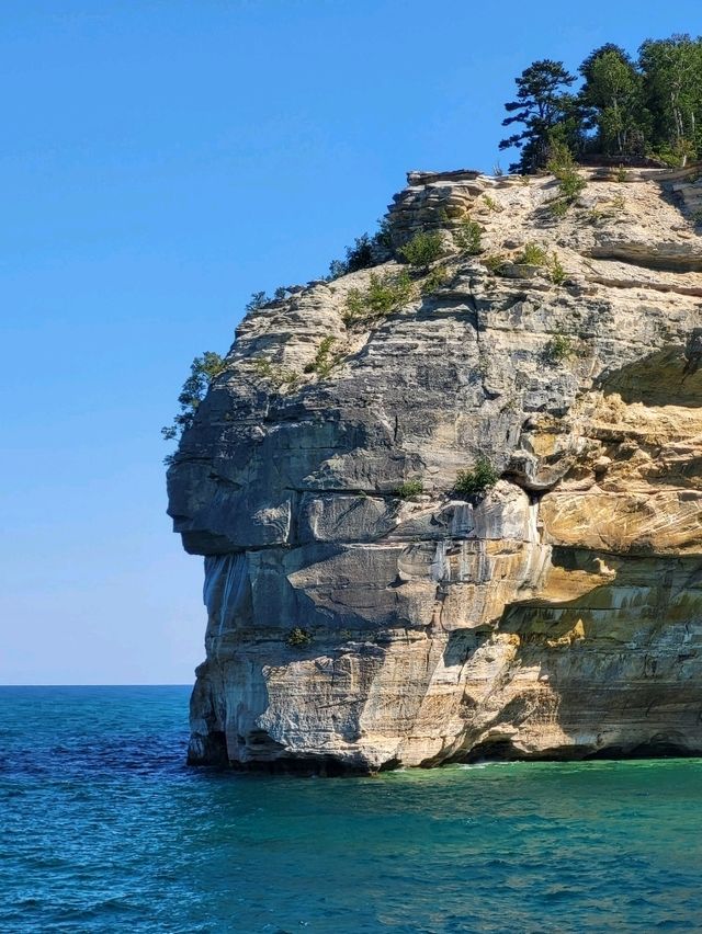 Discover the wild beauty of the crystal blue water and sandstone cliffs along Lake Superior in MI