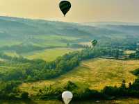 Hot air balloon ride above from Toscany sky 