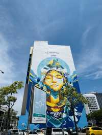 Art Up High — The Giant Mural That Watches Over KK
