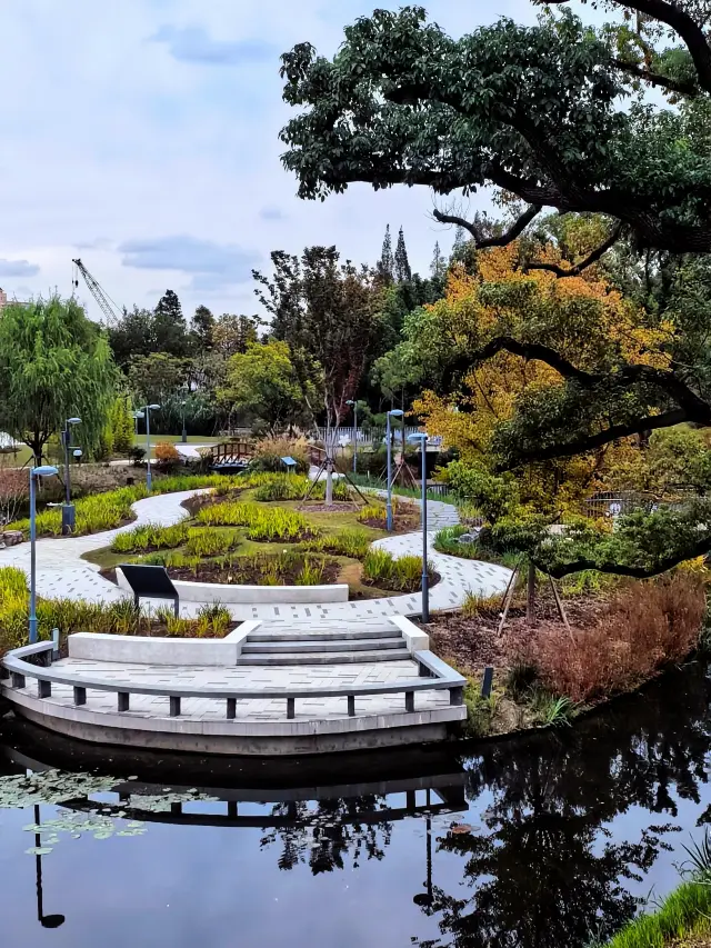The aerial walkway overlooks a colorful land painted with flowers and plants.