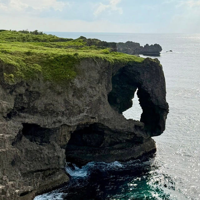 Cape Manzamo: Okinawa’s Dramatic Cliffside Wonder – A Solo Traveler’s Coastal Escape"** 🌊🗿