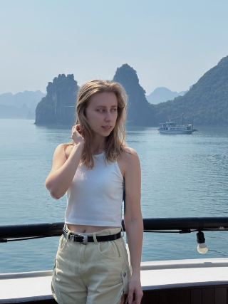 Golden hour magic among the limestone karst islands of Ha Long Bay! 🌅⛵