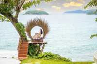 Phuket's backyard has a swing on the giant rock beach.