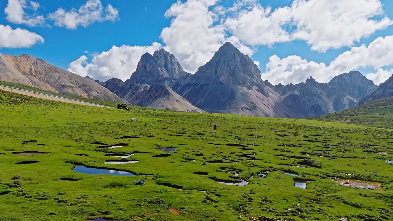 Chasing the Wild Beauty of Genie: A Land of Mountains, Grasslands & Sacred Peaks 🏔️🌿
 
Just got back from an unforgettable trip across Western Sichuan, and I absolutely have to share this with you all! If you haven’t added Genie (Ge’nei) to your travel bucket list yet, this is your sign.
 
Often known as the “Hidden Paradise of West Sichuan”, this land completely stole my heart. But the absolute highlight of my trip? The holy Genie Snow Mountain. It’s not merely a mountain; it is a towering massif surrounded by vast alpine meadows, wild rivers and primitive villages, revealing its magnificent silhouette under clear blue skies.
Trust me, to truly appreciate its magic, you have to see it from three different perspectives:
 
① From the Grassland Valley: Standing on the soft meadow at the foot of the mountains, you are fully surrounded by nature. Wandering the endless grasslands dotted with yaks and wild flowers, listening to wind sweeping across the valley, it feels like walking straight into a timeless Tibetan pastoral painting. The peaceful, raw vibe here is irreplaceable.
 
② From across the river: Head over to the viewpoint by the river. From here, the entire Genie range rises sharply above grasslands. When sunlight hits the snow peaks at golden hour, the glowing white summits reflect in the calm river water — pure magic and perfect for wide landscape shots.
 
③ From the mountain pass: Driving up to the high pass, you get the best of both worlds. Rolling grasslands stretch behind you, and the full, breathtaking panorama of Genie Snow Mountain unfolds right in front. It’s the perfect vantage point to witness how primitive Tibetan villages, wild grasslands and towering snow peaks blend together.
 
A few practical tips if you're planning to go:
⏰ Best time to visit: Late June to early October. Summer brings green meadows and wildflowers; autumn paints the valley in golden tones. Arrive around sunrise or sunset for the famous golden snow mountain glow.
📍 Getting around: Self-driving is the most flexible way to explore. Take it slow on mountain roads.
But be warned — this is high-altitude terrain. Take it easy, avoid rushing on your first day to prevent altitude sickness. Maps show roads, yet many viewpoints sit quietly tucked between hills. Embrace the winding roads; adventure is part of the fun.
 
🍲 Food you can't miss: You can’t leave without trying authentic Tibetan meals in a local village. Taste butter tea, Tibetan buns and tender yak meat hot pot (rich and hearty to fight the mountain chill!). For a quick bite, grab a bowl of yak yogurt, sweet and refreshing after hiking.
 
West Sichuan’s Genie is wild, quiet, and incredibly breathtaking. Have you ever been to a place that feels like stepping into a fantasy wilderness? Let me know in the comments!
 
