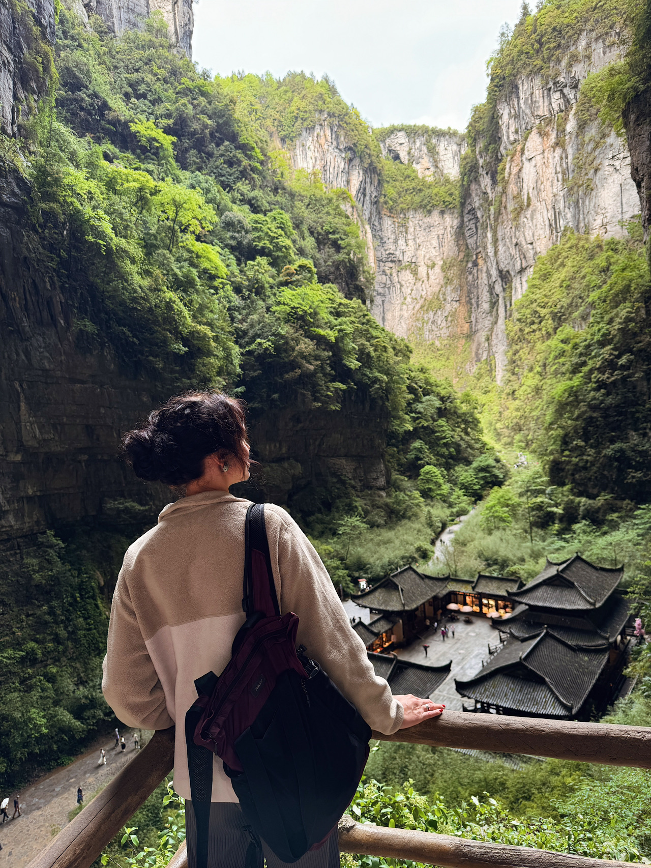 If you're in Chongqing and looking to see something truly epic, I highly recommend The Three Natural Bridges in the Wulong district.

These are massive stone arches nestled among cliffs that are hundreds of meters high. While the photos make it look beautiful, being there in person feels like stepping right onto a movie set.

How to get there from Chongqing?
The easiest way is taking a high-speed train to Wulong Station. The ride takes about 2 to 2.5 hours, and one-way tickets run roughly 50–80 RMB, depending on the train you catch.

From the station, you'll need to hop on a bus or grab a taxi to the tourist area, which takes another 40–60 minutes.

How much is the entrance fee?
Admission to The Three Natural Bridges is around 125 RMB. The internal shuttle is usually an extra fee (often bundled into a combo ticket, but it's always best to check the current rates).

How much time do you need?
Plan for at least 3 to 4 hours to take your time and explore the trail without rushing. Expect a fair amount of stairs, walkways, and plenty of stops for photos.

A quick tip: comfortable walking shoes are a must. It might look like a breeze in photos, but you'll actually be doing a solid amount of walking.

If you're also planning to hit up Fairy Mountain and the canyon, you're much better off spending the night in Wulong. Doing it all in one day is doable, but it makes for a super jam-packed itinerary.