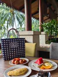 rainforest setting, over-water chalets, private beach, and friendly service