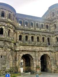 Step through the ancient Porta Nigra,