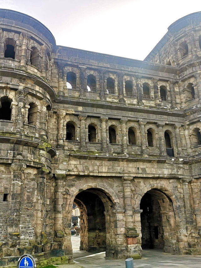 Step through the ancient Porta Nigra,