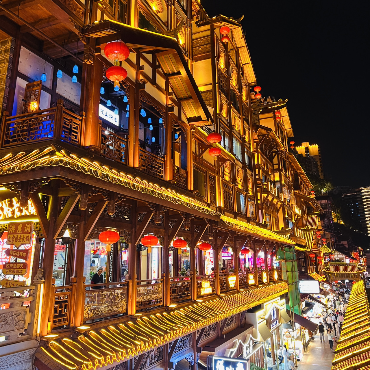 Chongqing is a city that defies gravity and common sense altogether. It’s a mind-bending 8D maze where maps flat-out lie to you and taking the elevator might just drop you 10 floors up. To help you avoid getting lost and actually enjoy the ride, here are the ultimate survival hacks.

🗺️ Navigation: Maps Lie, Prep Your Feet

· Brace yourself for the climb: Forget about flat streets. Chongqing is an endless workout of stairs and steep hills. Rock your most comfortable flat shoes and ditch the luggage at your hotel—lugging suitcases around this city is a total nightmare.
· Go local with apps: Google Maps is practically useless here. Your best bets for navigating the city are Amap (高德地图) or Baidu Maps.

🚇 Getting Around: Metro, Taxis, and Cable Cars

· The metro is your bestie: Hands down the best way to get around. Fares start at just 2 RMB. Golden rule: hold onto your ticket until the end of the ride, or you'll get slapped with a 10 RMB fine at the exit.
· How to pay: Download Alipay or WeChat and set up your transit QR code. Cash is barely a thing here anymore.
· Taxis (Didi): Cheap and super convenient. Hail a ride using the Didi app (accessible right inside Alipay).
· Yangtze River Cableway: An absolute must-do. A one-way ticket sets you back 20 RMB. Pro tip: board at Xinjiezi station—it's way less crowded.

🏨 Accommodation & Gear

· Where to crash: Jiefangbei is the prime spot. You’ll be within walking distance of all the major hotspots.
· Juice up your tech: Pack a heavy-duty power bank (10,000–20,000 mAh). Wall outlets are scarce, and your phone battery will drain fast from constantly checking directions.

🍜 Grub: How to Dodge the Tourist Traps

· Where NOT to eat hot pot: Hard pass on Hongyadong and Jiefangbei—they’re overpriced and underwhelming. Hunt down old-school joints tucked away in residential neighborhoods where the locals flock.
· Bayi Road: An absolute street food heaven. Don't miss the Xingji tofu, Li Ruotao's pastries, and the iconic hot and sour noodles.
· Bamboo tube milk tea: Don’t fall for the hype—it’s an overpriced gimmick.

🏙️ Top 5 Must-See Spots

· Hongyadong: The real-life inspiration for the city in "Spirited Away". The skyline lights up from 7:00 PM to 11:00 PM. Best views? Hit up the Qiansimen Bridge or the opposite bank of the river. Entry is totally free, so don't get scammed by street "guides" asking for cash.
· Liziba Station: The famous metro train that literally drives through a residential apartment block. Skip the platform view and head outside around the back of the building for the best photo ops.
· Yangtze River Cableway: Epic bird's-eye views of the sprawling city. Snag a window seat and hit record—the scenery changes by the second.
· Shibati (Eighteen Flights of Stairs): A historic spot and the "air corridor" of old Chongqing. It’s perfect for snapping some retro-vibe photography. Heads up: the steps are seriously steep.
· Eling Park: A killer observation deck boasting panoramic views of the city. It really puts Chongqing’s insane urban planning into perspective.

📅 Timing & Threads

· Prime time to visit: Spring (March–May) and Autumn (September–November).
· Dress code: Leave your light-colored and easily stained clothes at home. The local grub is notoriously oily, and grease splatters are just part of the experience.
· Rain check: Always keep a compact umbrella on hand.