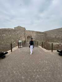 “Whispers of the Past: The Timeless Walls of Bahrain Fort”