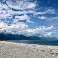 Escape to the pristine shores of Qixingtan Beach, where the mountains kiss the ocean