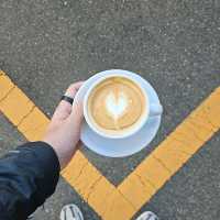 a nice little cafe by a parking lot