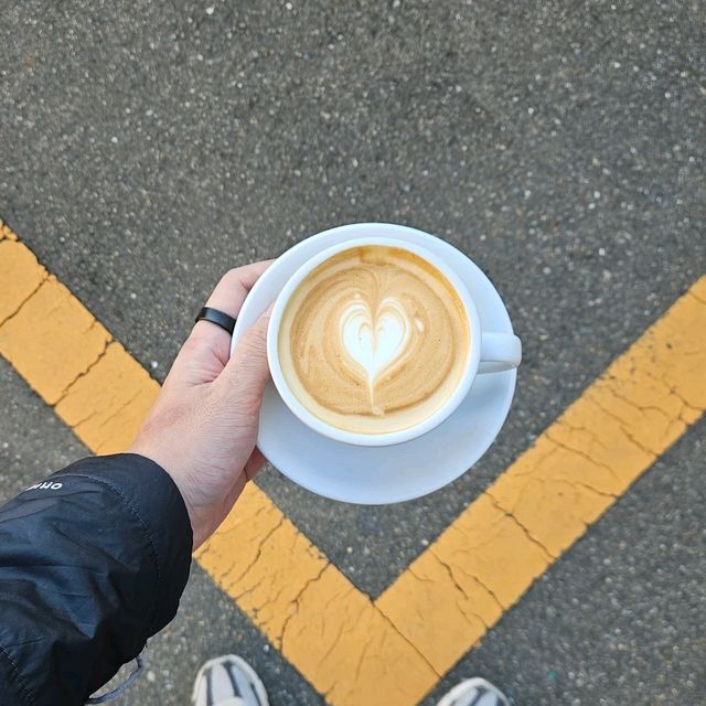 a nice little cafe by a parking lot