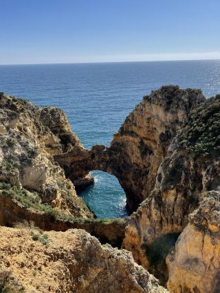 🇵🇹 Algarve | Portugal 🌊☀️
Stunning beaches and spectacular cliffs – another must-visit corner of Portugal 💙

When talking about beautiful beaches in Europe, the Algarve in southern Portugal is definitely a place you shouldn't miss.

The charm of this place lies in the golden cliffs that stretch along the coast, contrasting with the deep blue sea and the vast sky. On a clear, sunny day, the sea looks incredibly beautiful. From some spots, you can see the clear water and rocks below – a view you'll never tire of.

The Algarve has many viewpoints along the cliffs, each with its own unique beauty. Some are small coves hidden between cliffs, others are high rocks standing in the sea, and some offer breathtaking views of the Atlantic Ocean stretching as far as the eye can see.

I love this atmosphere. Just walking along the cliffs, feeling the sea breeze, and gazing at the blue sea is so relaxing. There's no need to rush or do many activities; simply finding a nice spot to sit and enjoy the view is enough to make you happy all day.

Must-visit spots include Praia da Marinha and Ponta da Piedade, famous for their stunning cliffs and rock formations. Nature photography enthusiasts will find plenty of photo opportunities! 📸

It's recommended to wear comfortable walking shoes, as many areas involve walking along cliffside paths, and some sections are quite uneven. Importantly, avoid getting too close to the edge of the cliffs.

The beauty of the Algarve isn't just in the sea, but in the overall atmosphere – the sunlight, the sea breeze, the colors of the cliffs, and the feeling of gazing at the expansive view.

This is another region of Portugal I highly recommend experiencing firsthand. While photos may be beautiful, the real-life atmosphere is even more impressive. 🩵

📍 Algarve, Southern Portugal 🇵🇹

#Algarve #Portugal #AlgarvePortugal #TravelPortugal #PortugalTravel #EuropeTravel #BeachTravel #PraiaDaMarinha #PontaDaPiedade #TravelPortugalOnYourOwn