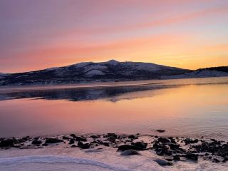 The unique northern nature of the Magadan region has always been distinguished by its beauty and harshness. I have visited many beautiful bays, including Gertner Bay, which is located 25 minutes away from the city of Magadan. During low tide in Gertner Bay, the sea recedes by more than 50 meters. 

During low tide, the sea becomes so shallow that the seabed is exposed. The seabed often turns white due to the abundance of feeding seagulls. The bay has beautiful sunsets, and the colors of nature are unique and unreal. In winter, the coast is covered with a dazzling layer of ice. 
The bay is beautiful at any time of the year. In August 2025, the bay's beach was improved, and comfortable recreation areas were created. If you're lucky, you may spot seals, which can be seen in the early morning when they are having breakfast. 
There is a bus stop, a cafe, the Dukcha Ethnic Park, and recreation areas near the bay. 

Do you enjoy outdoor activities?